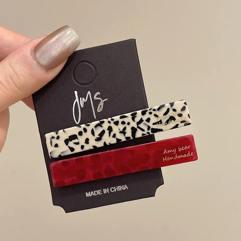 Set of 2 geometric hair clips in dalmatian print and red