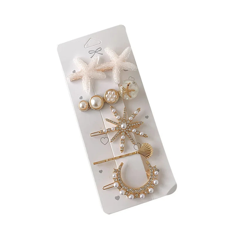 Starfish, simulated pearl and rhinestone moon hair pins on a display card