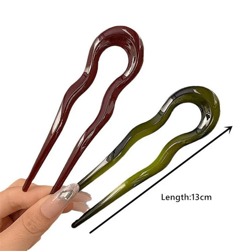 Burgundy and olive green French hair pins beside an arrow labeled Length: 13cm