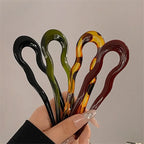All 4 Duo colors in one hand: black, olive green, tortoiseshell pattern and burgundy French hair pins